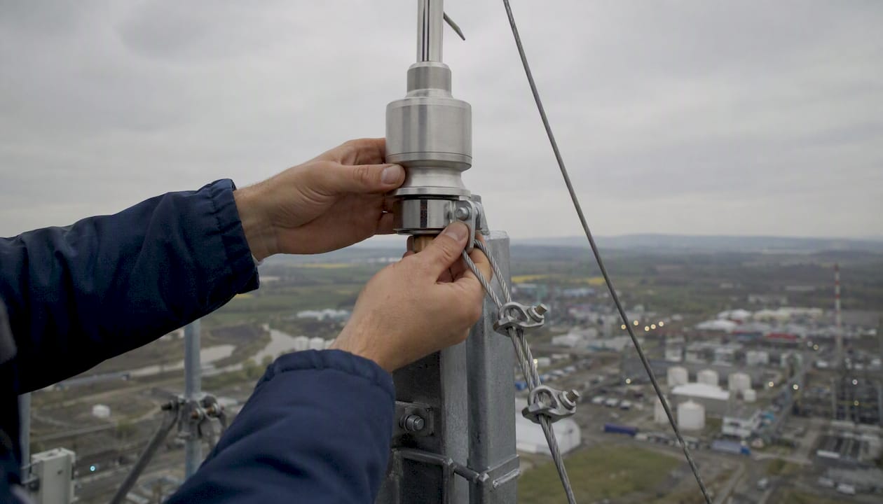 Hands installing ESE lightning device