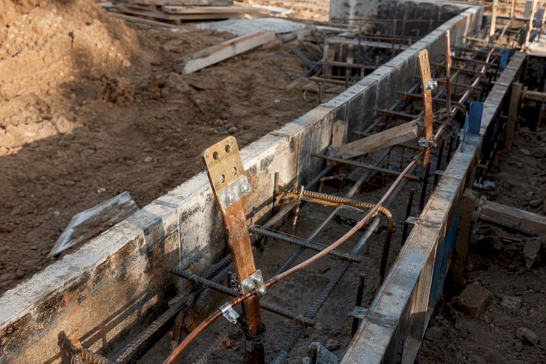 Foundation trench with grounding lugs and bonding points before pour
