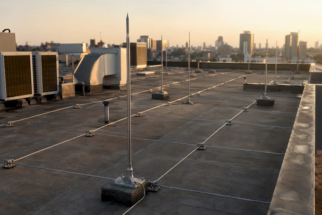 Franklin rods and meshed cage on industrial rooftop