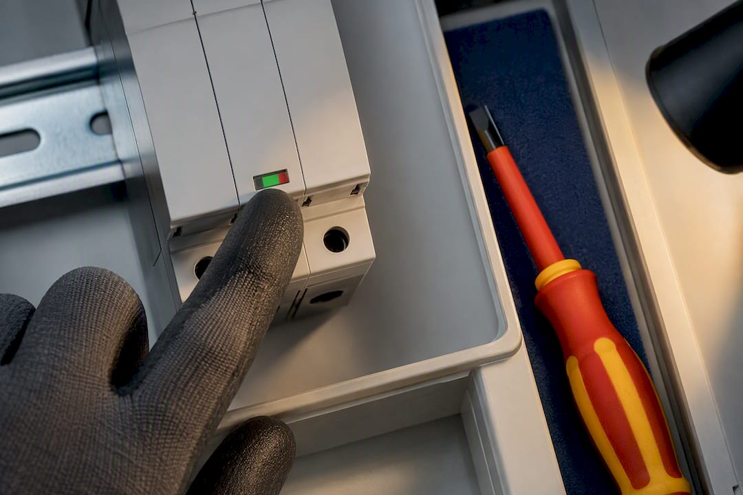 Technician checking SPD status indicator