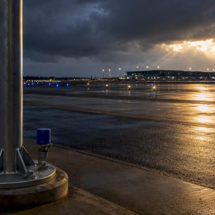 Airport ramp beneath lightning protection mast