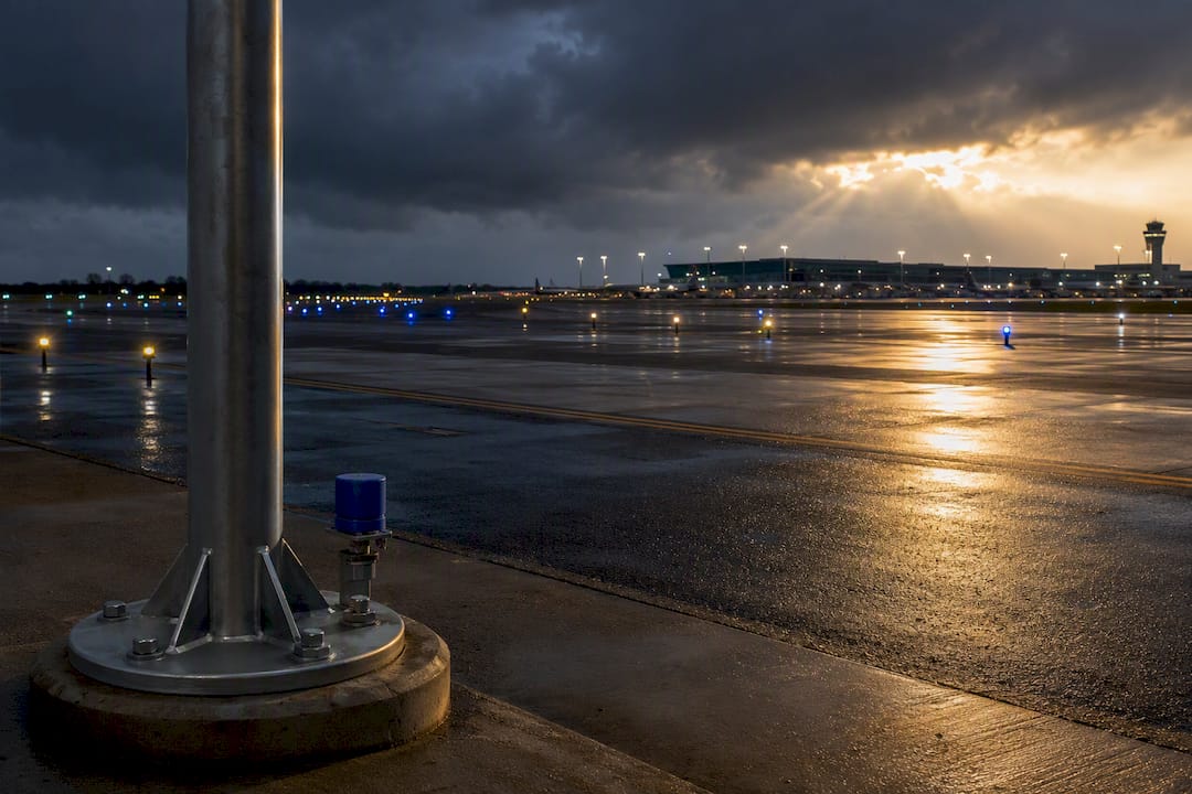 Airport ramp beneath lightning protection mast
