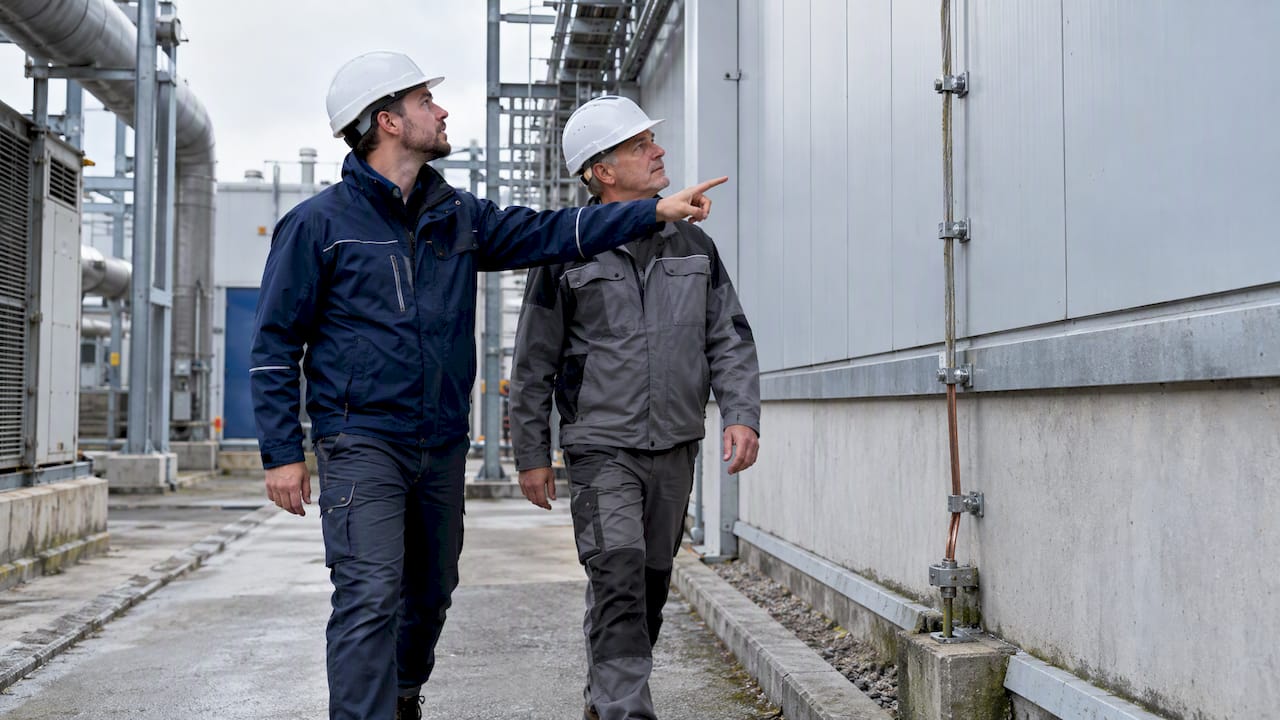 Engineers inspecting industrial lightning protection