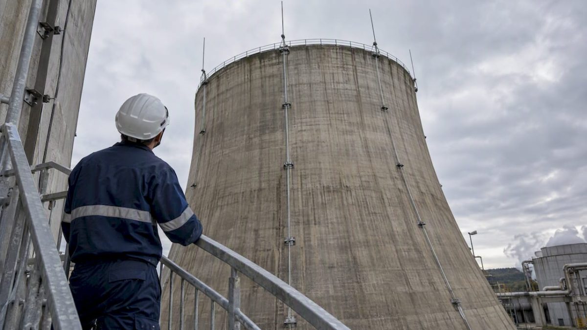 Technician inspecting cooling tower lightning protection