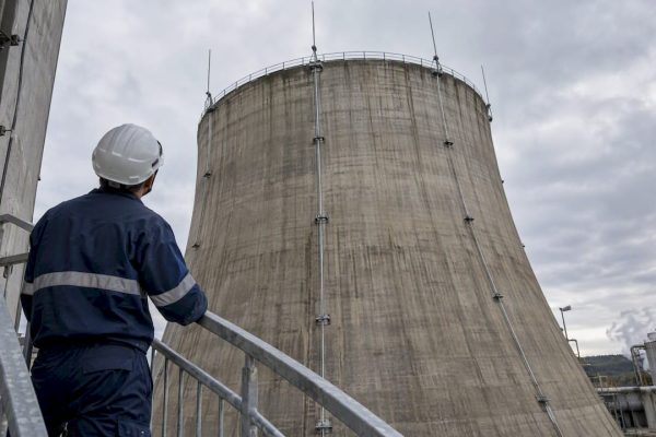 Technician inspecting cooling tower lightning protection