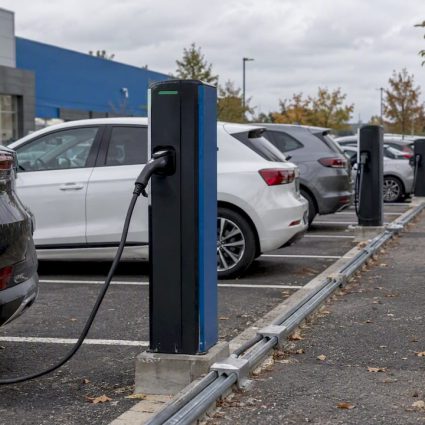 EV chargers in an open French parking lot