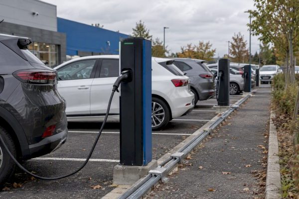 EV chargers in an open French parking lot