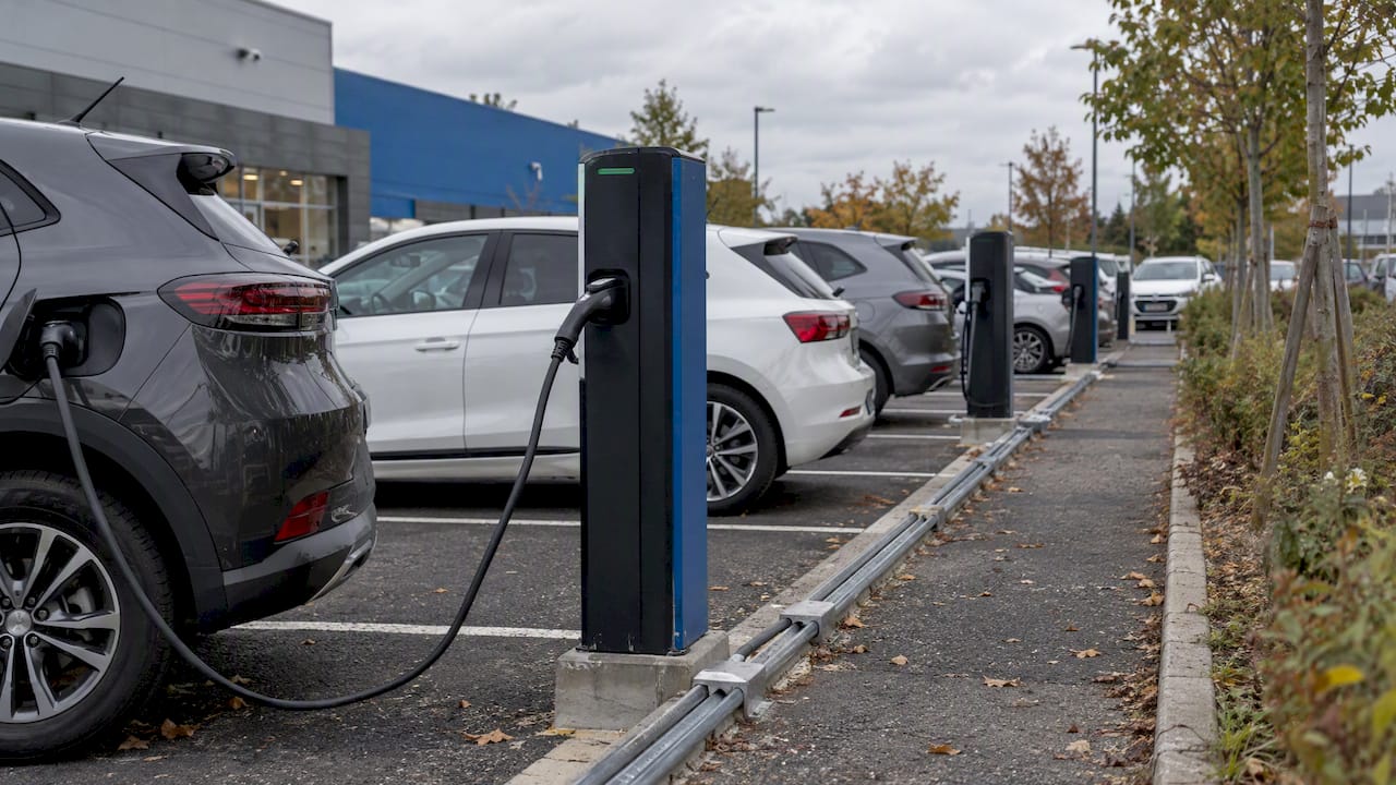 EV chargers in an open French parking lot