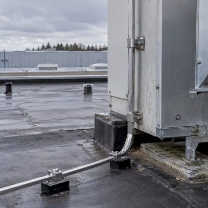 Down-conductor separated from nearby rooftop metalwork
