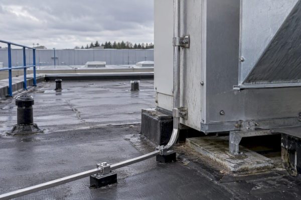 Down-conductor separated from nearby rooftop metalwork